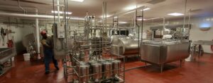 man working in food processing facility - infrastructure insurance premiums